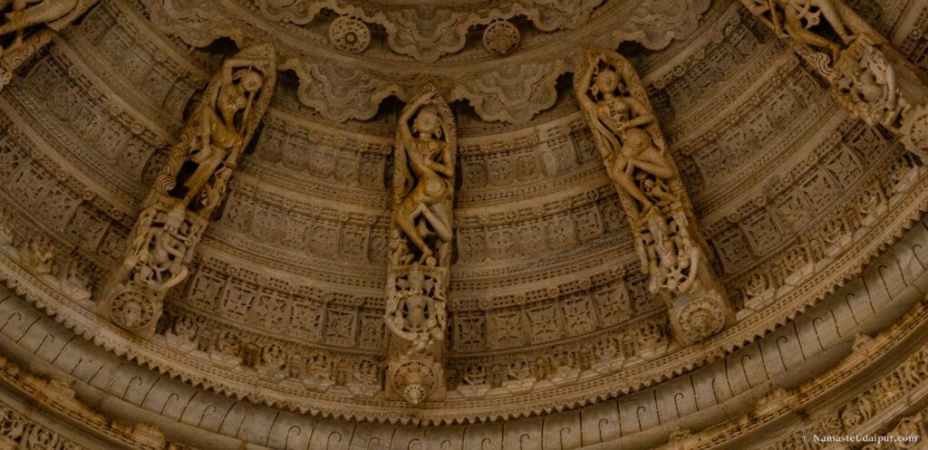 central shikhara features 360° hanging sculptures of celestial nymphs (apsaras) in dynamic poses, seeming to float mid-air.